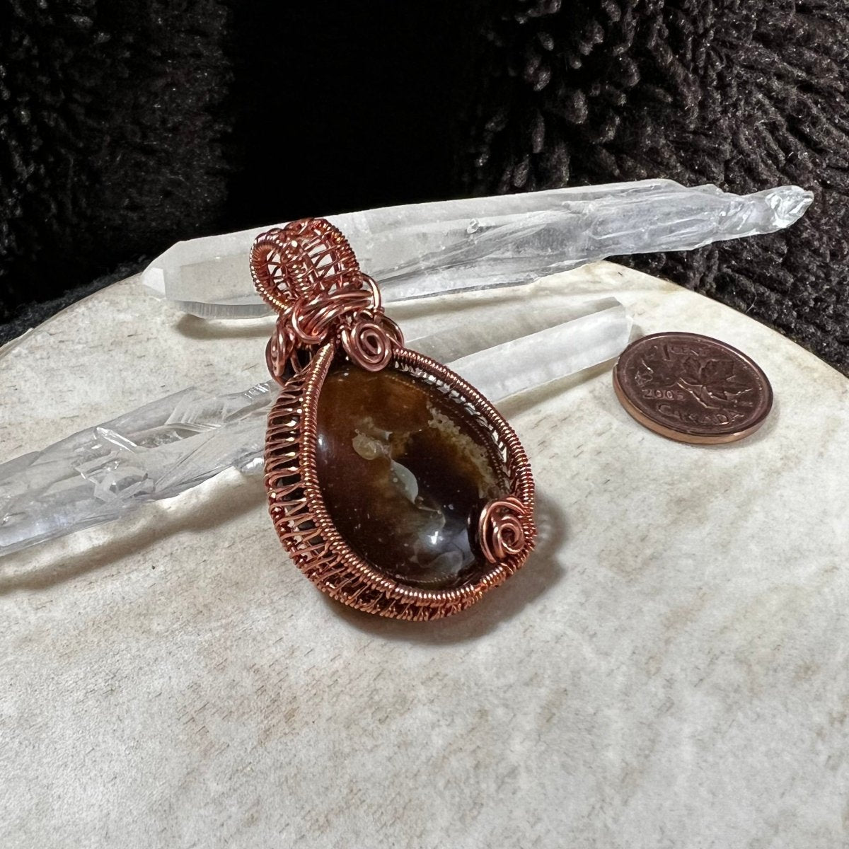 Back view of pendant showing handcrafted copper framework