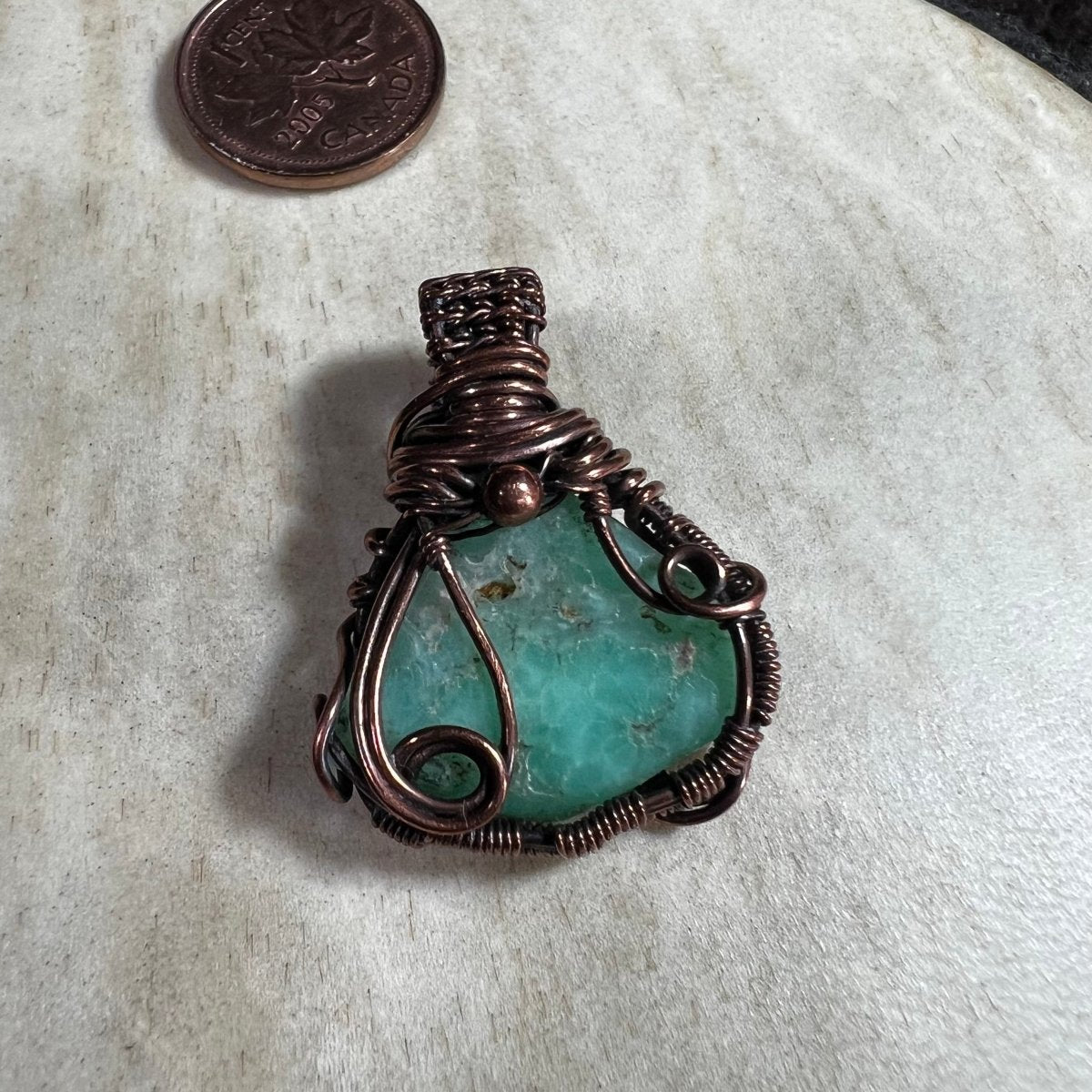 One-of-a-kind Chrysoprase gemstone pendant in woven reclaimed copper wire with spiral detail.