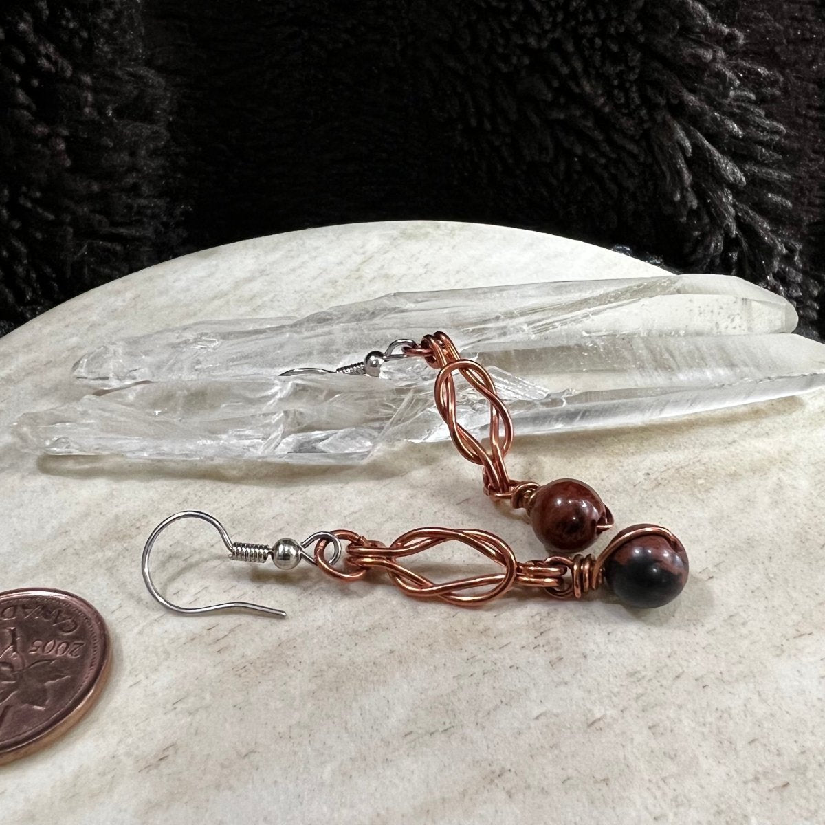mahogany obsidian earrings with copper wire wrapping and surgical steel earwires, handmade brown and black stone dangle earrings on neutral background