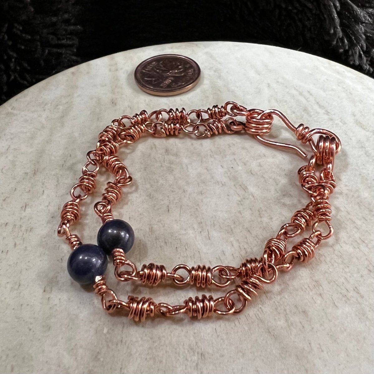 sodalite double strand bracelet with 6mm blue beads and reclaimed copper wire links, handmade calming clarity bracelet on neutral background