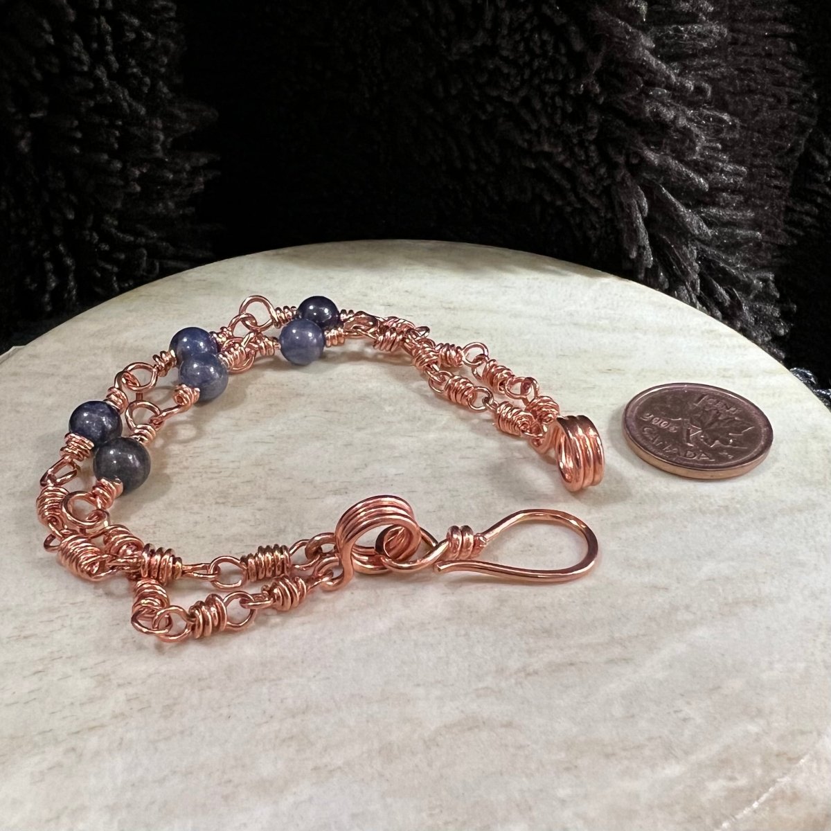 sodalite double strand bracelet with reclaimed copper wire links, handmade asymmetrical clarity bracelet on neutral background