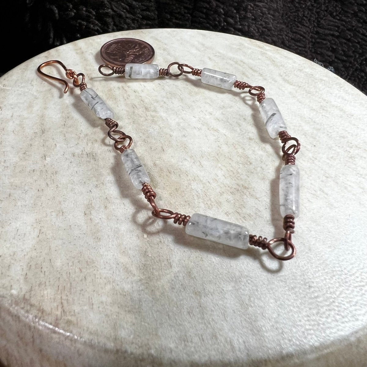 Natural tourmalinated quartz bracelet featuring clear quartz with black tourmaline inclusions and reclaimed copper links