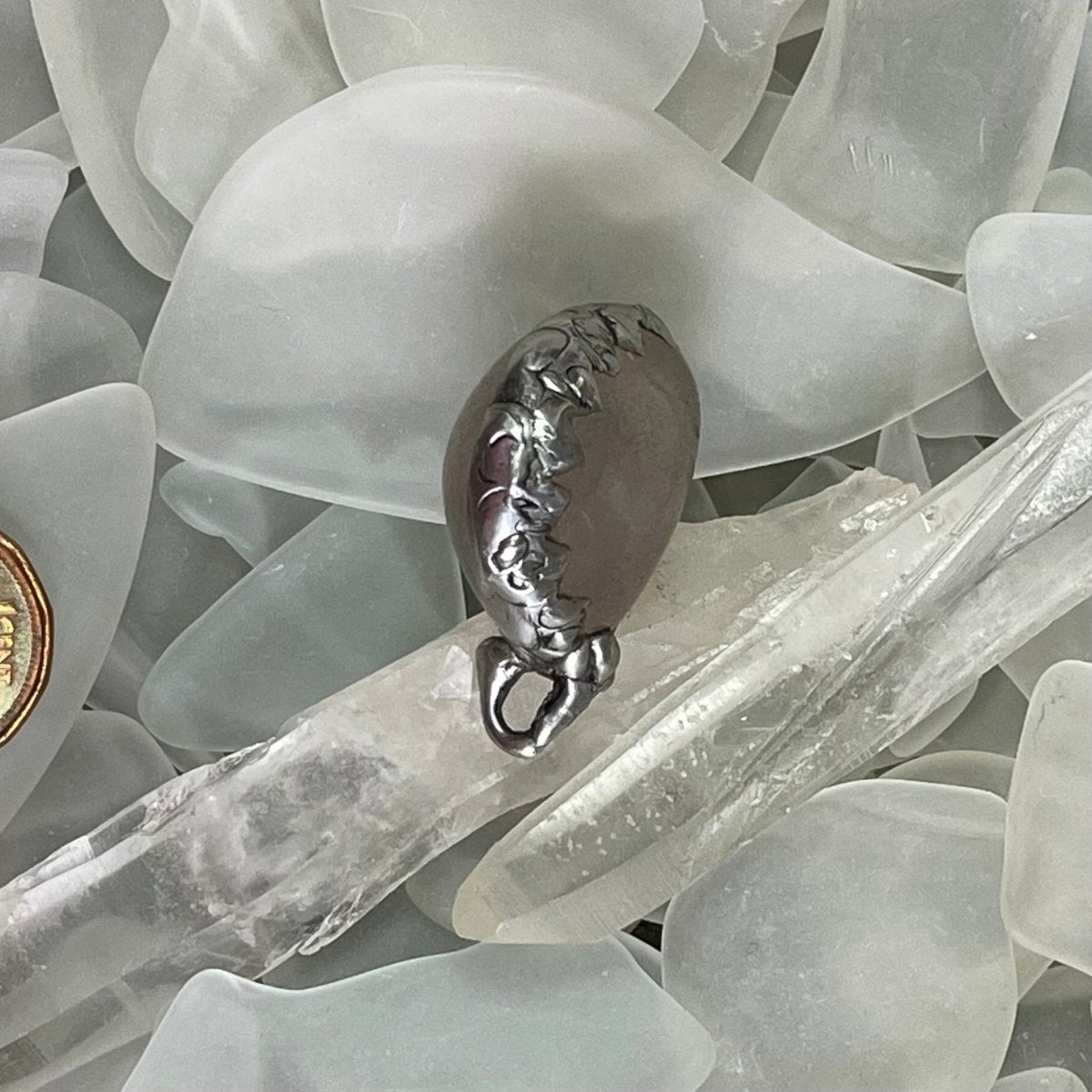 Bay of Fundy Quartz Pendant - close up view of decorative soft solder bezel