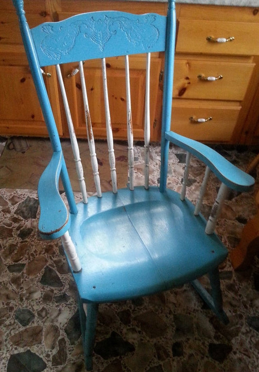 An empty rocking chair in the artist's kitchen