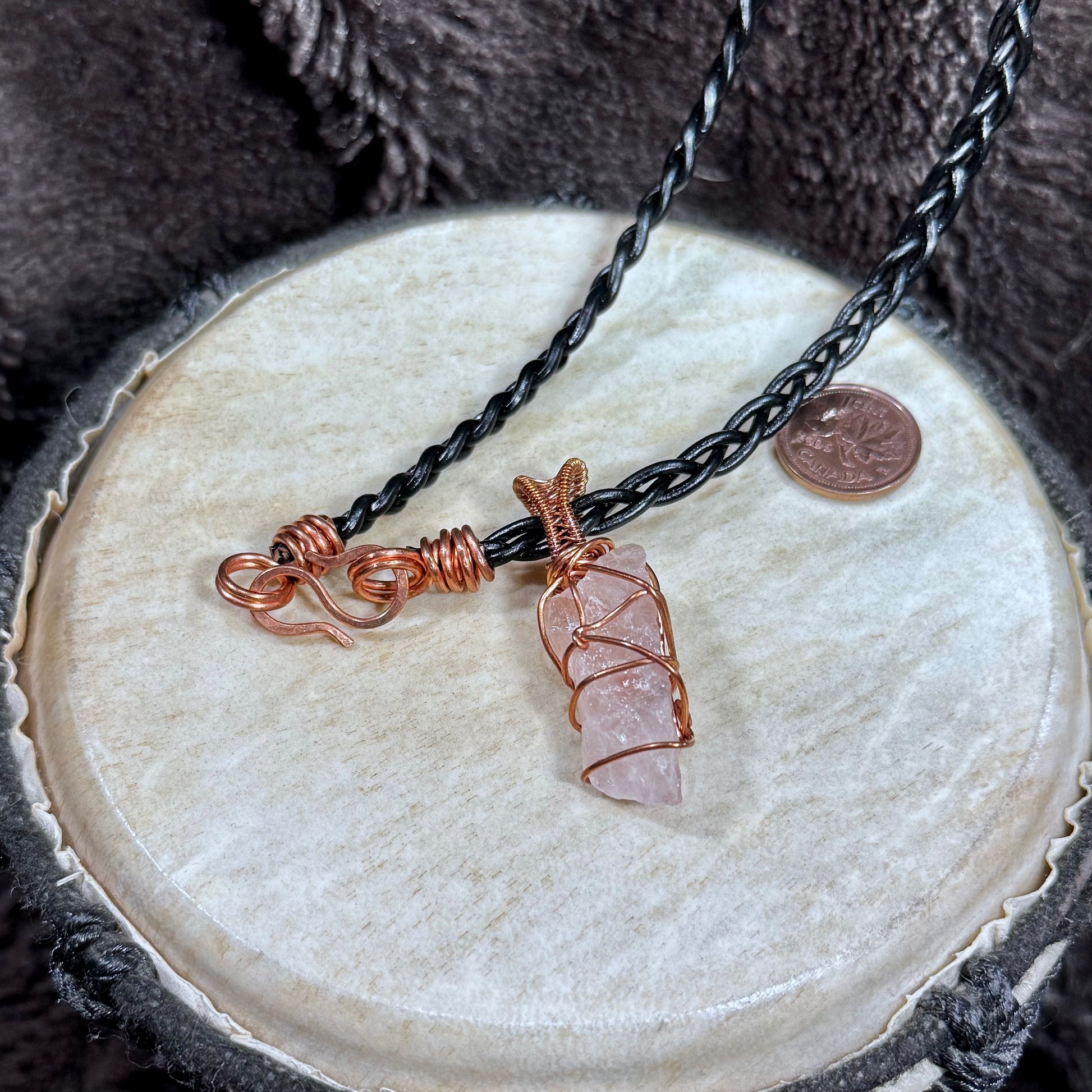 Raw Rose Quartz and reclaimed copper necklace with black braided leather lace and handmade copper hook-and-eye clasp.