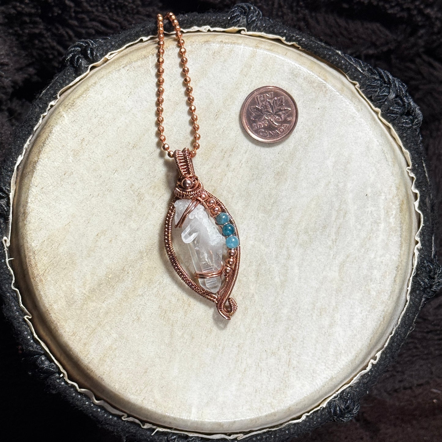 Front view of a handmade Lemurian crystal necklace in raw copper open weave with blue apatite bead accents on a 22 inch copper ball chain.