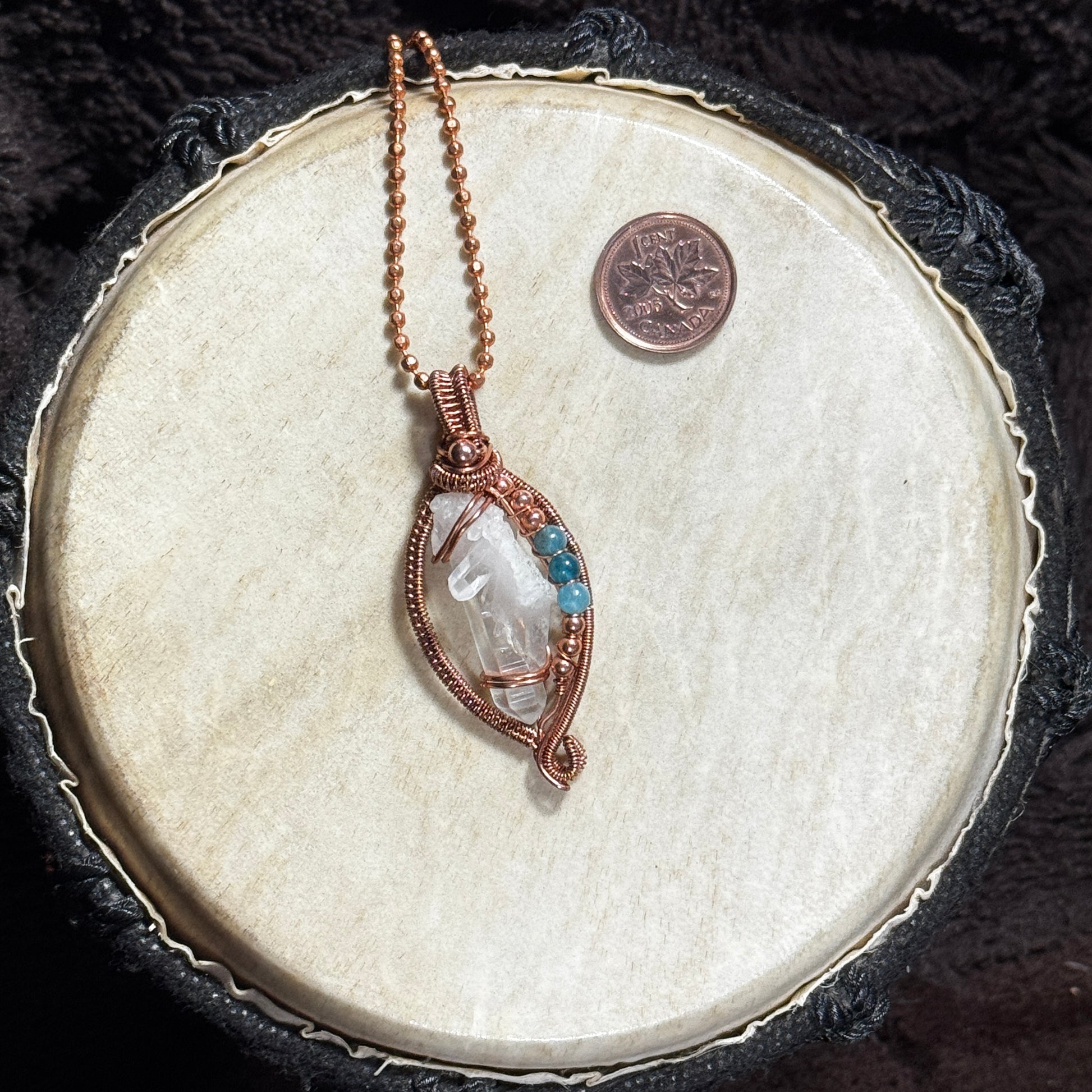Front view of a handmade Lemurian crystal necklace in raw copper open weave with blue apatite bead accents on a 22 inch copper ball chain.