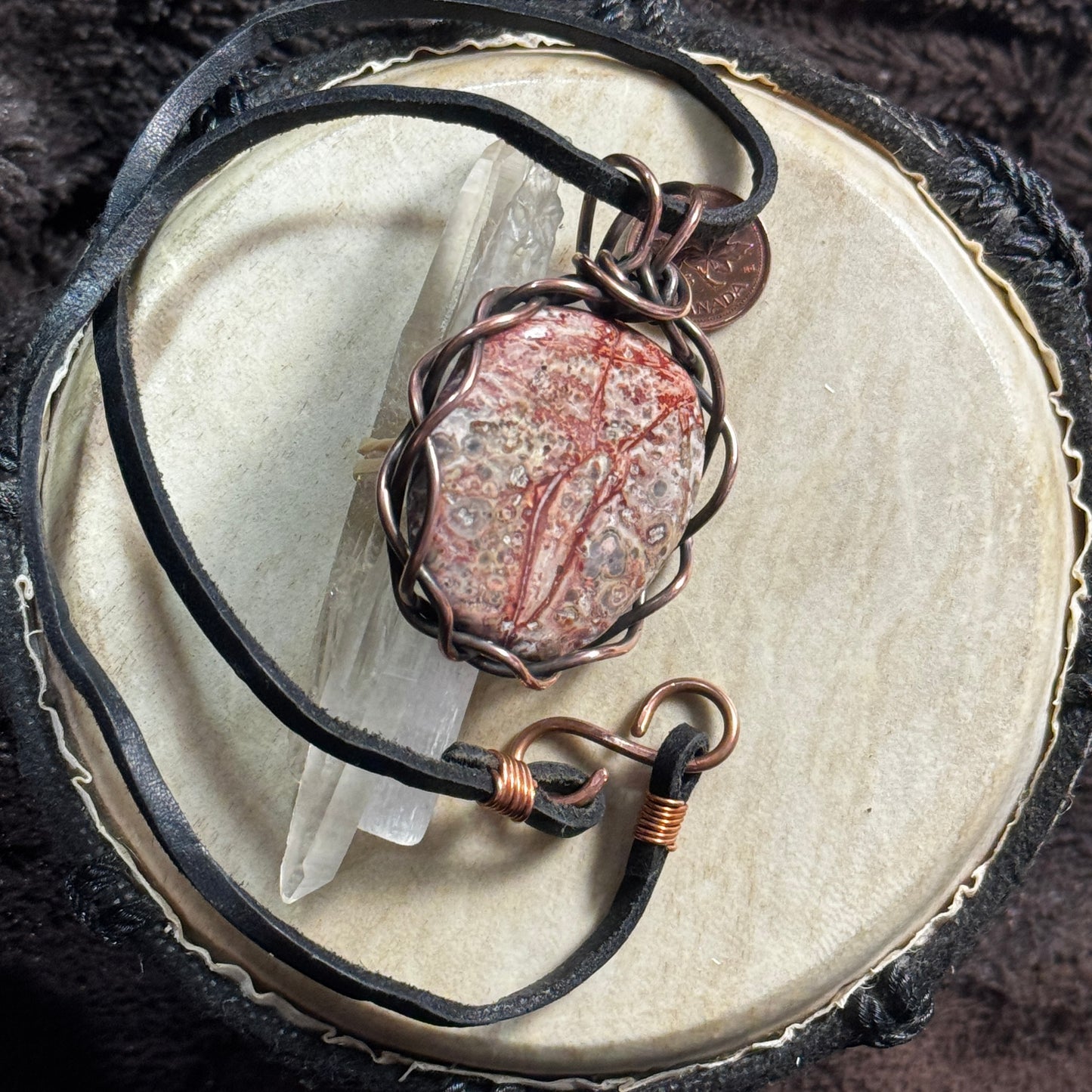 Full view of a reversible Leopardskin Jasper necklace with reclaimed leather cord and handmade copper S clasp.
