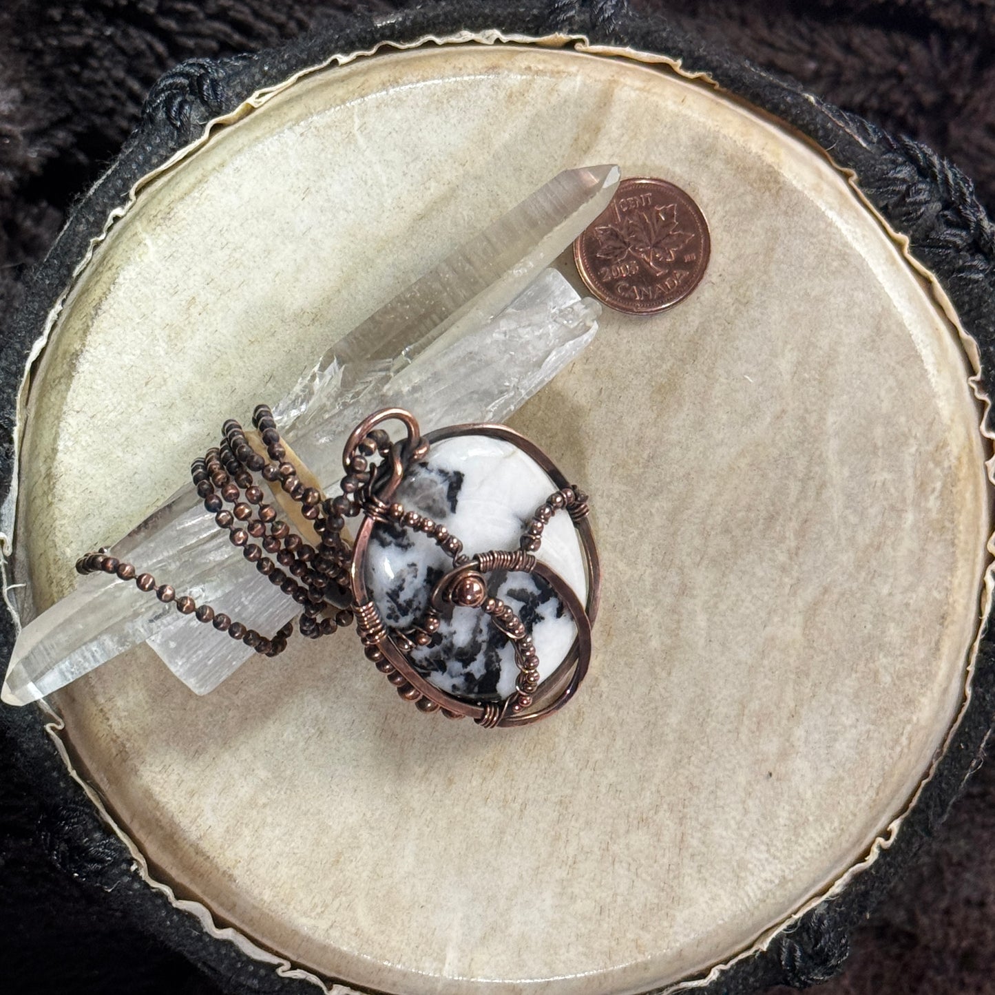 Moss agate pendant in copper displayed with a quartz point, showing the reversible design and faceted copper ball chain.