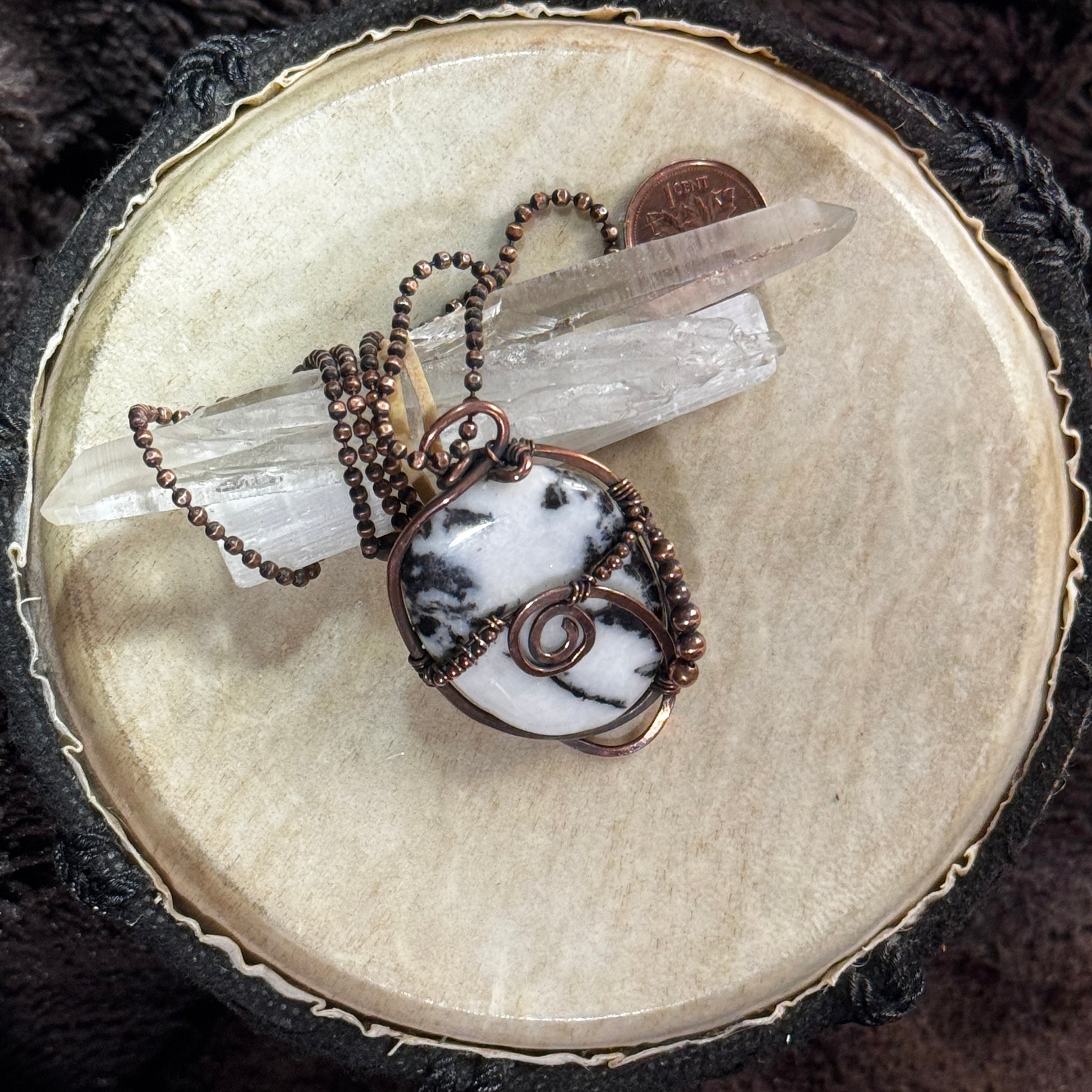 Alternate display view of a handmade reversible moss agate necklace with copper bead details and a hand-planished copper frame.