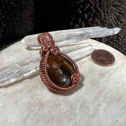 Back view of pendant showing handcrafted copper framework