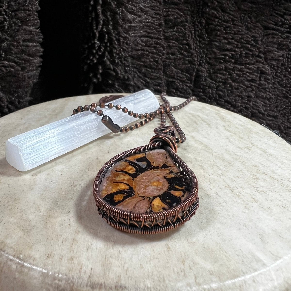 Handcrafted ammonite fossil necklace wrapped in reclaimed copper, Mother of Metal artisan jewelry