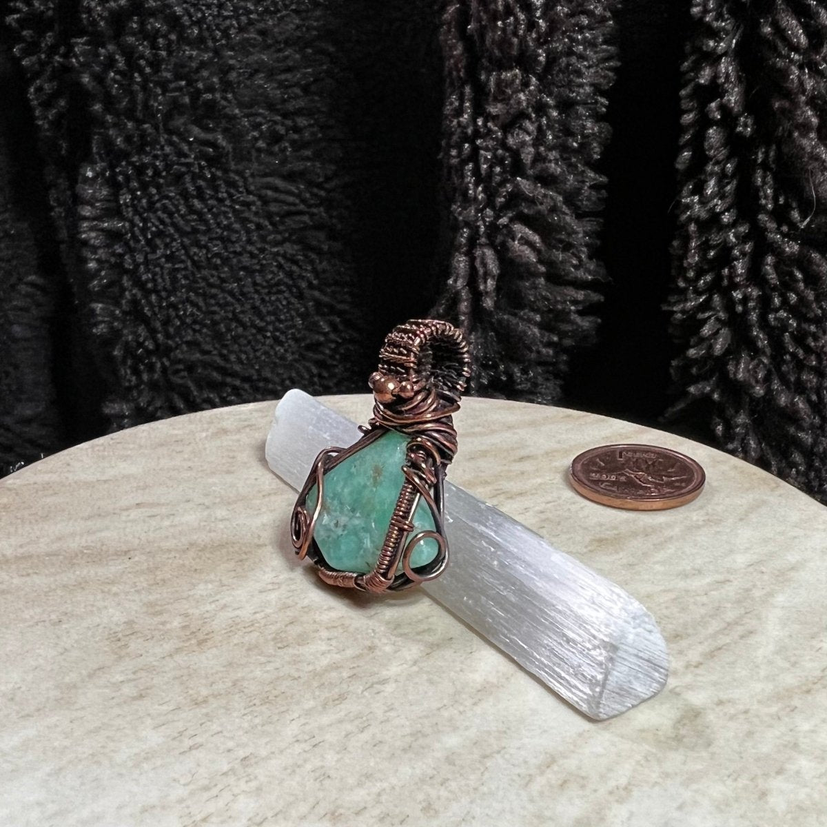 Handcrafted Chrysoprase copper pendant showing natural apple-green gemstone and organic wire wrap. Side view.