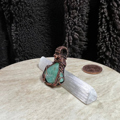 Handcrafted Chrysoprase copper pendant showing natural apple-green gemstone and organic wire wrap. Side view.