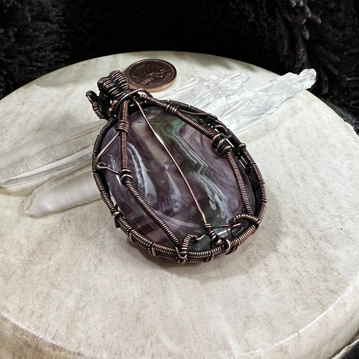 Back view of pendant showing secure handcrafted copper framework and patinated finish