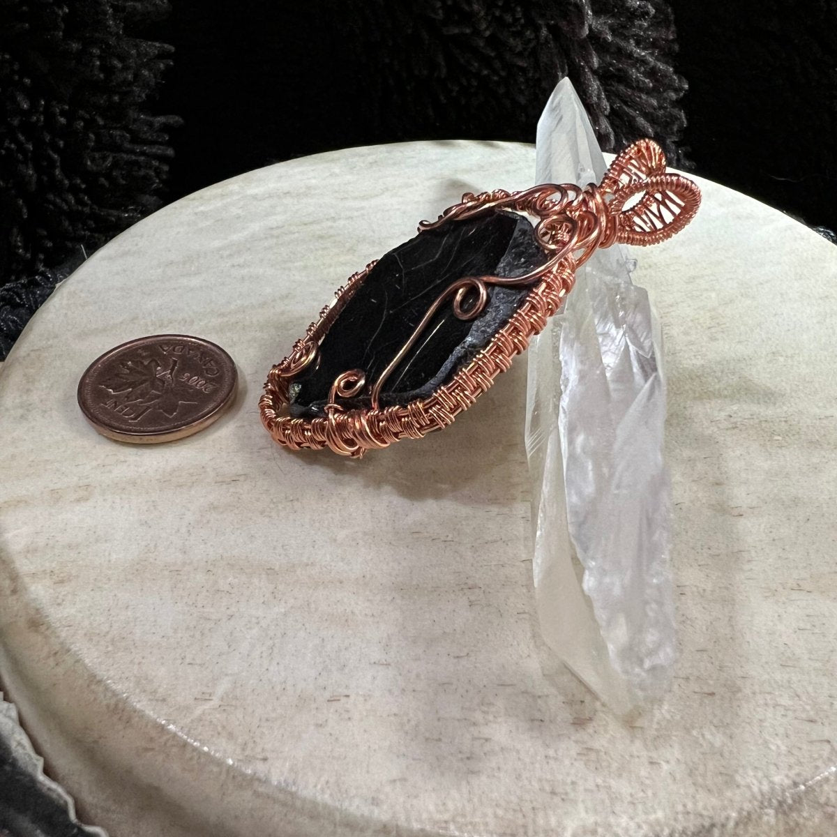 garnet slice pendant wrapped in reclaimed copper with dark maroon translucent stone, polished faces and raw edges, handmade grounding crystal pendant