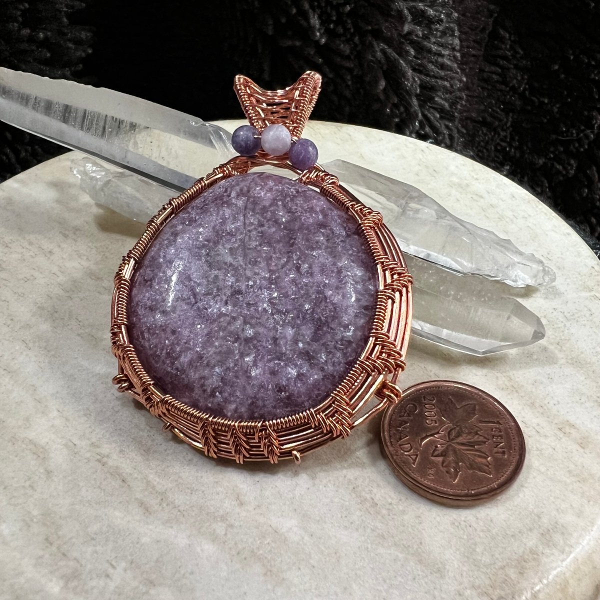 lepidolite pendant wrapped in reclaimed copper with soft lilac stone and bead accents, handmade calming crystal necklace on neutral background