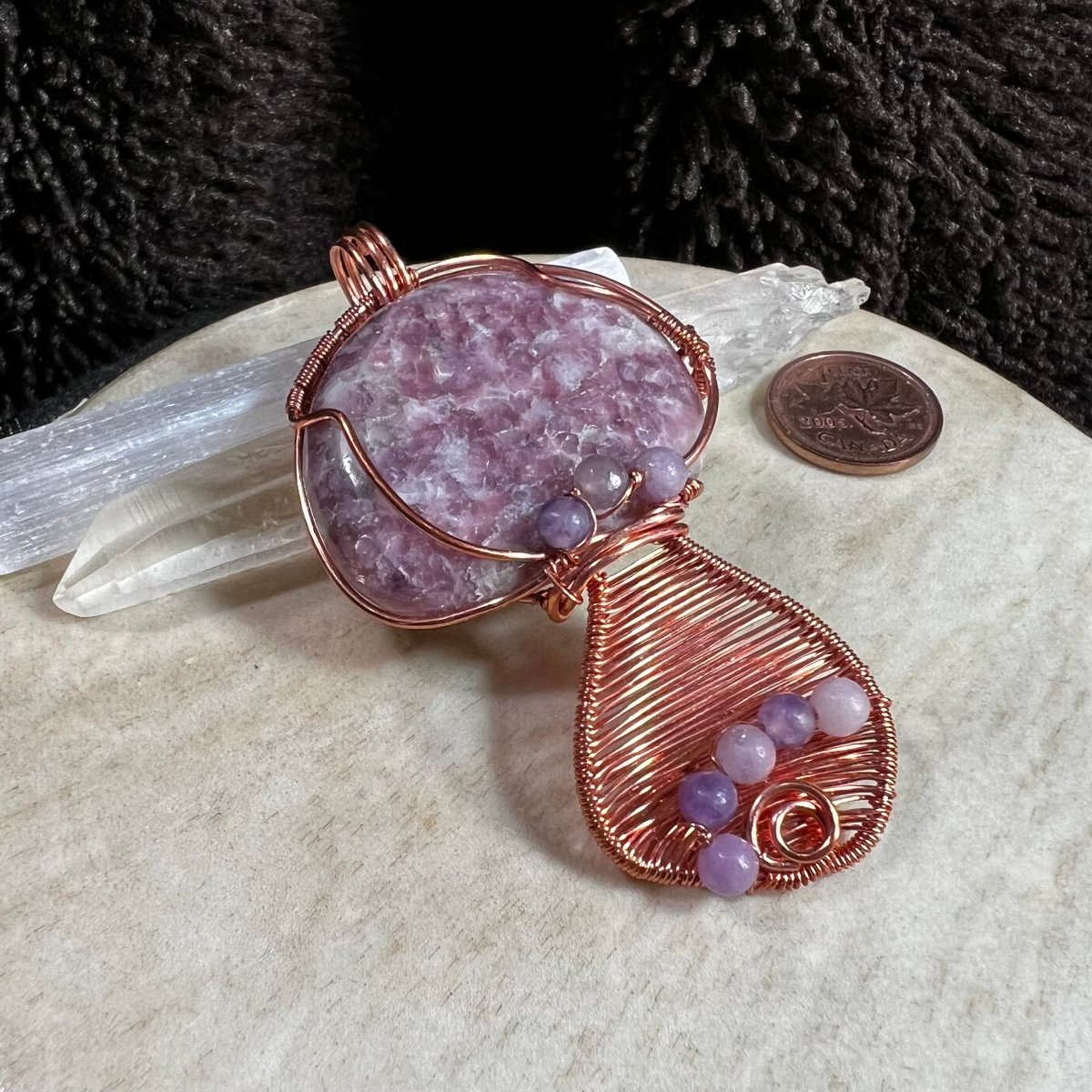 Lepidolite palm stone mushroom pendant with soft lilac tones wrapped in copper