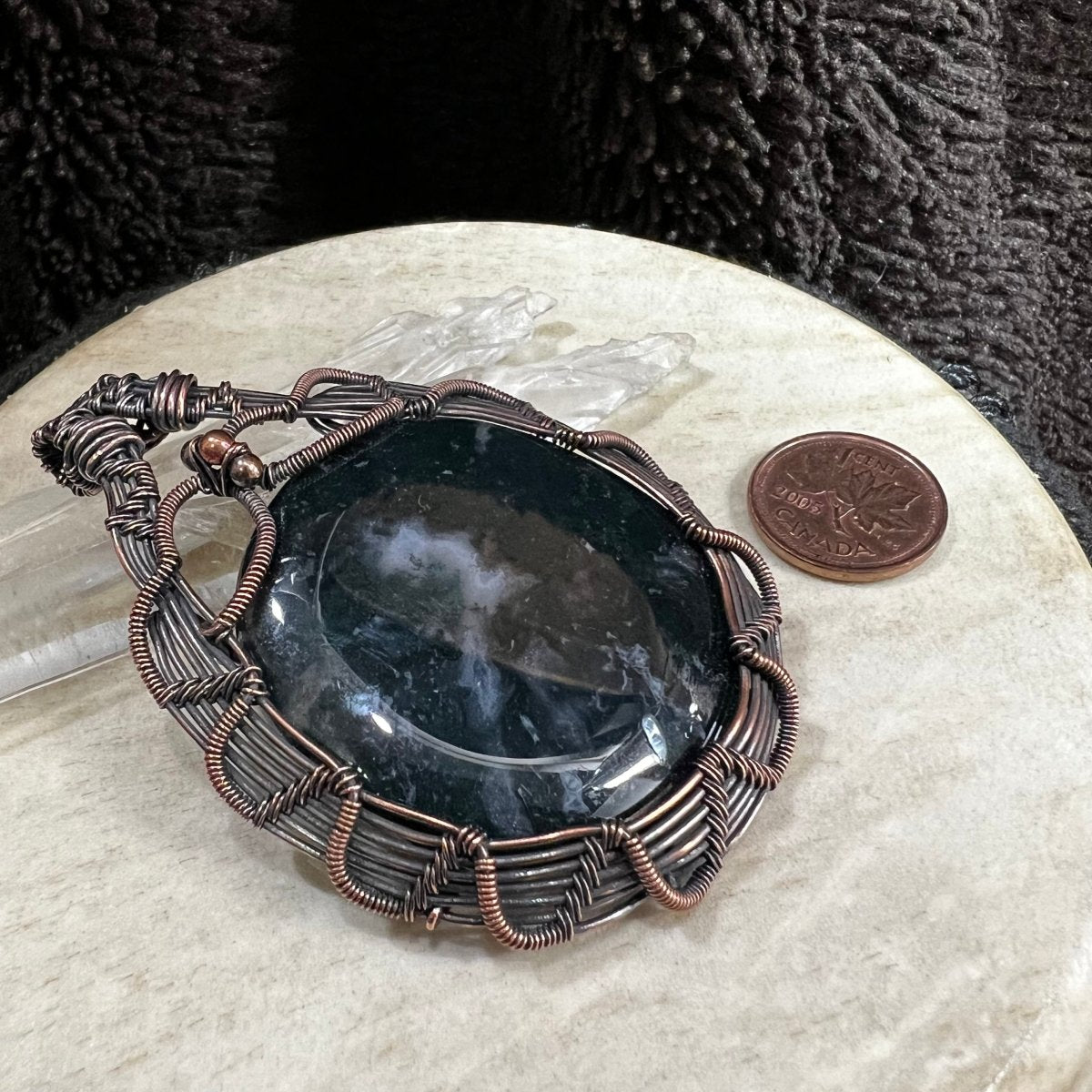 Moss agate pendant with deep green polished stone wrapped in patinated copper