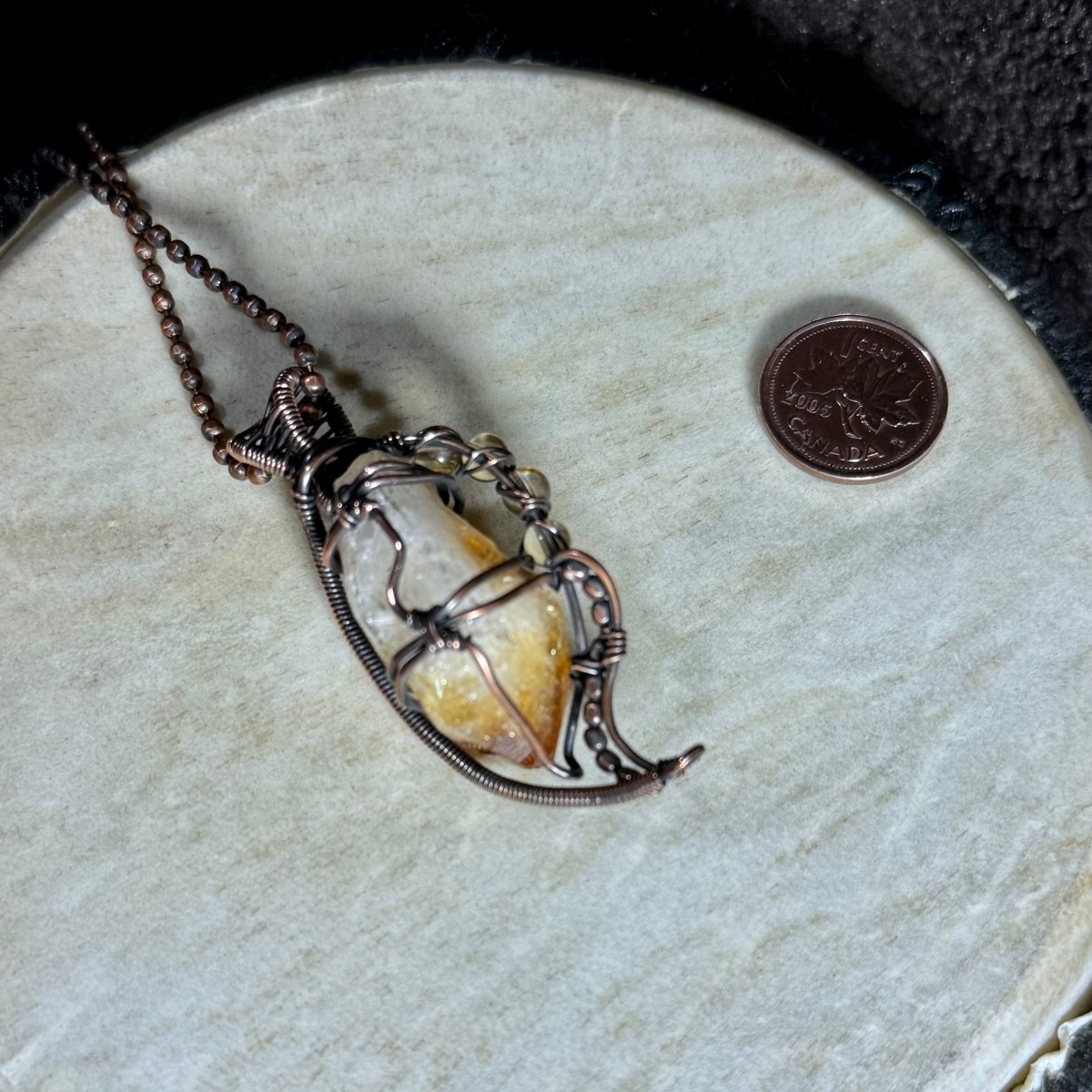Back view of the raw Citrine point necklace showing the secure open copper framework, bead details and handwoven bail.