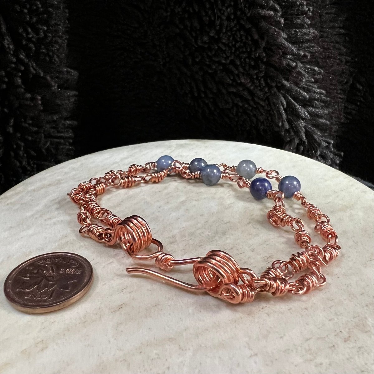 sodalite double strand bracelet with reclaimed copper wire links and 3 beads per strand, handmade calming crystal bracelet on neutral background