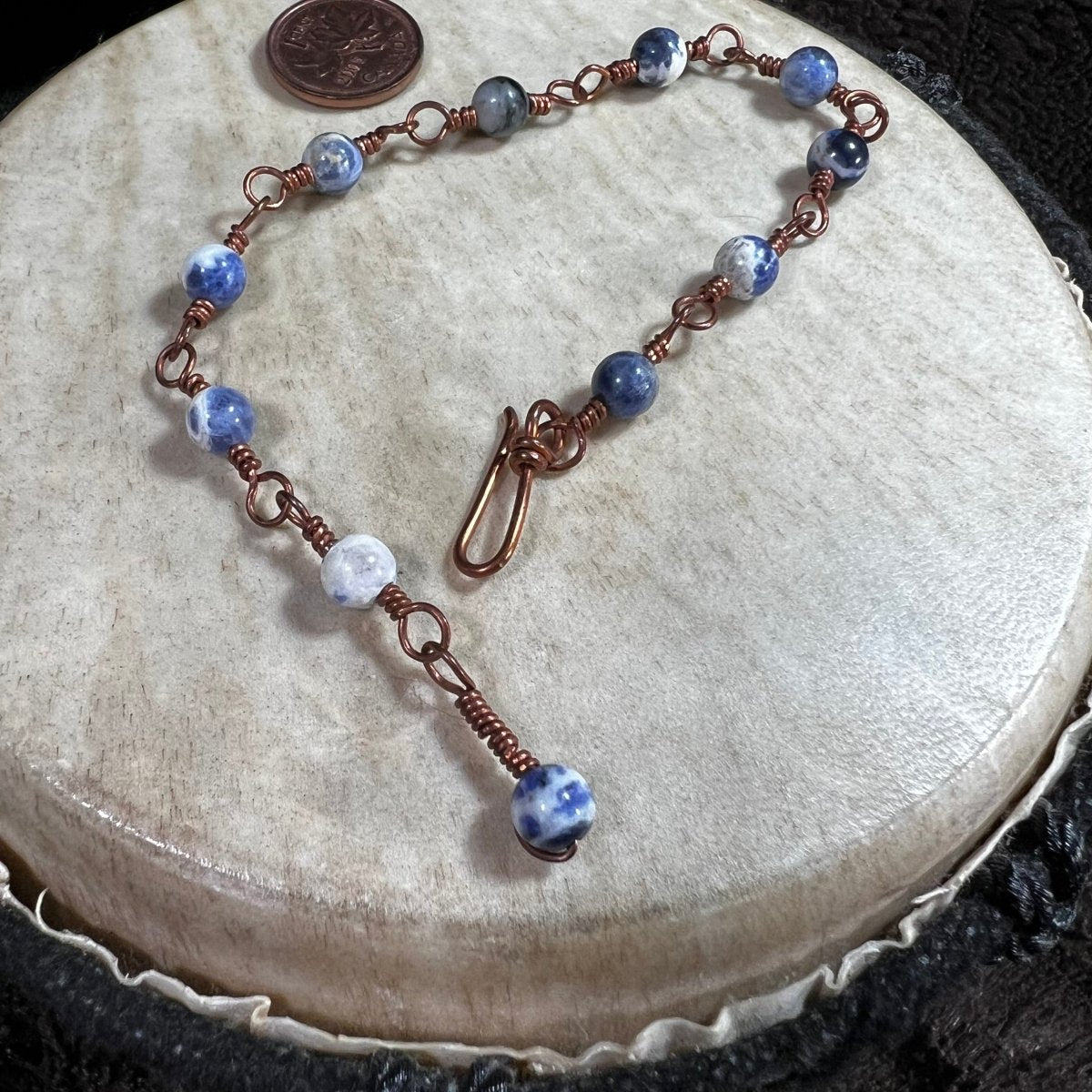 Handcrafted sodalite bead bracelet with copper wire links and sodalite dangle clasp