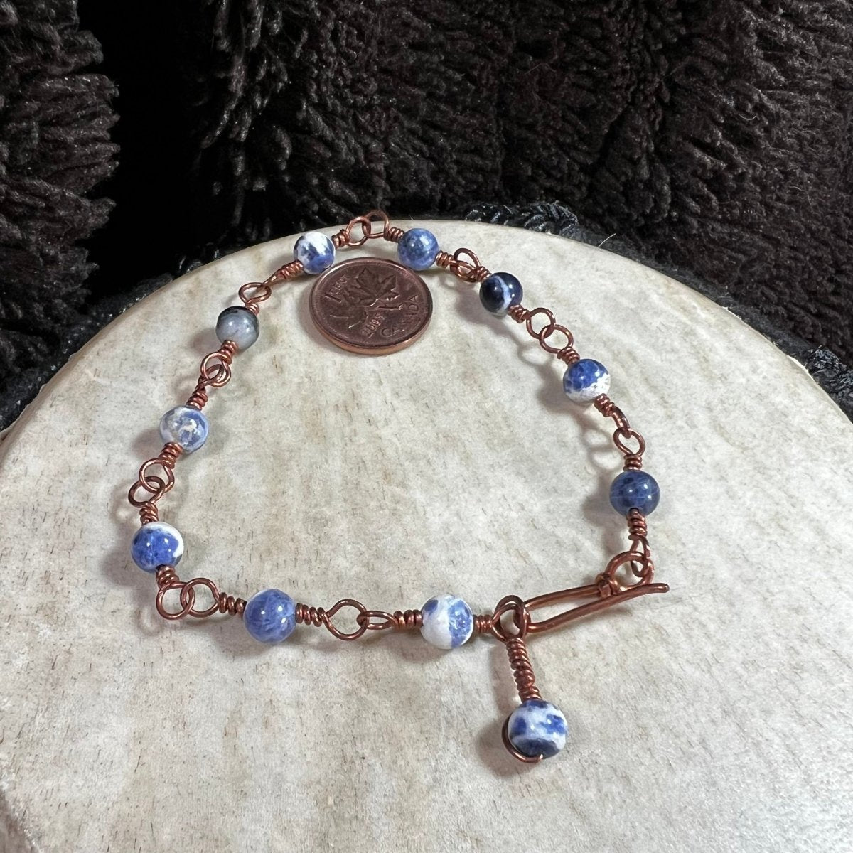 Natural blue sodalite bracelet with white marbling in rosary style copper wire jewelry