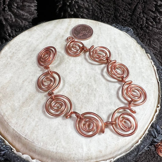 Handcrafted copper swirl bracelet with spiral links, Mother of Metal artisan jewelry