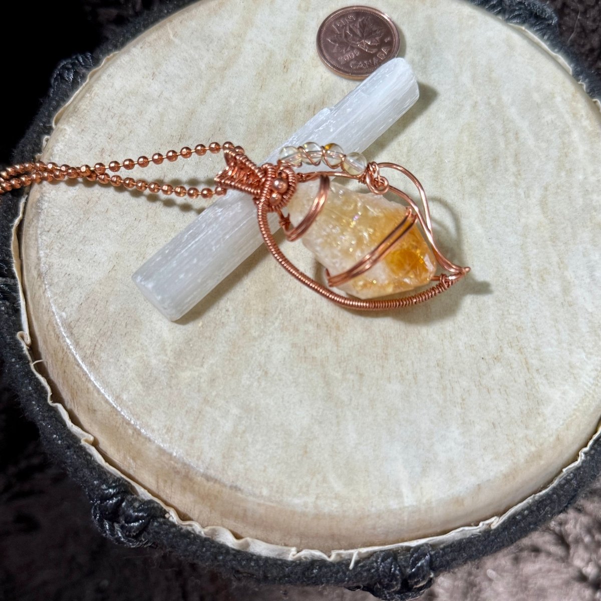 raw citrine point necklace showing natural crystal textures, tiny internal rainbow flashes, citrine bead accents and woven copper details.